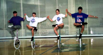 Connie, Kelsey, Christie and Neil (TCUC) demonstrate creative one-foot wheel walk.