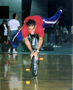 Josue Barreto from Puerto Rico does hand-wheel walk, superman style.